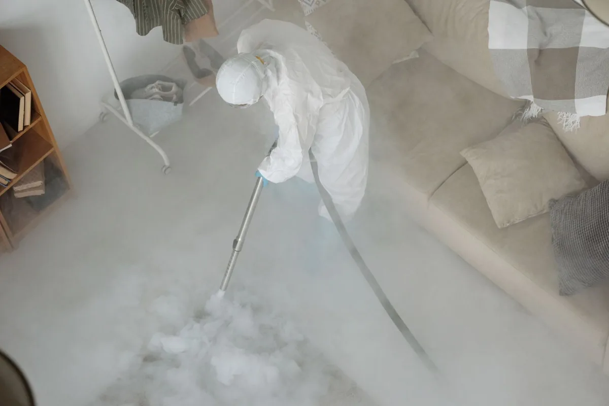 Biohazard cleanup technician in protective equipment, White Cloud, MI